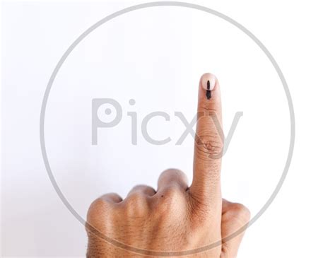 image of voter showing inked finger after casting vote in elections