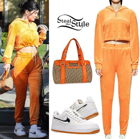 kylie jenner orange tracksuit white sneakers steal  style