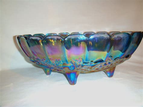 Blue Iridescent Carnival Glass Bowl With A Footed Bottom And A Harvest
