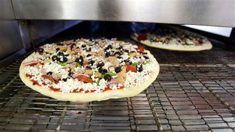 dominos opens   pizza restaurant  italy abc news