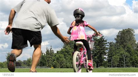 daughter riding bike without training wheels stock video footage 1895634