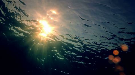 sun rays shining  water ripples stock footage sbv