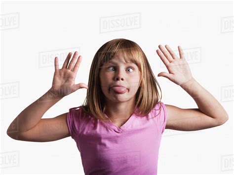 young girl making silly face stock photo dissolve