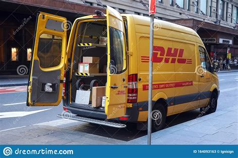yellow dhl car parked  sydney cbd area express courier delivery  mail parcels