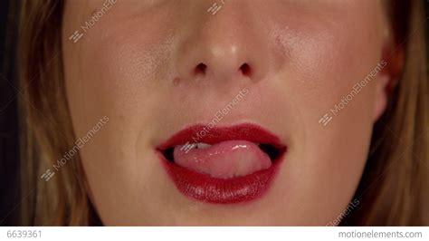 Close Up Slow Motion Female Licks Her Red Lips Stock Video Footage