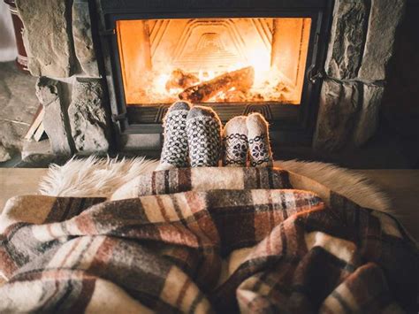 couple cozying up to fireplace cozy fireplace autumn cozy cozy couple