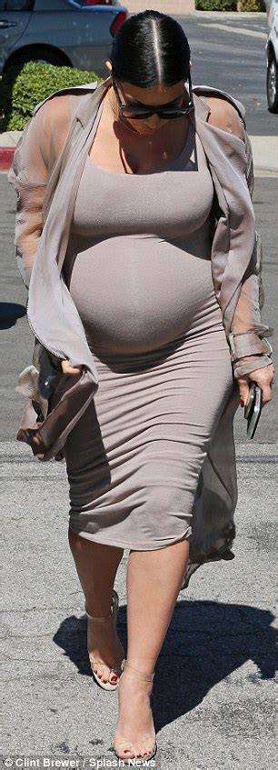 Kim Kardashian Puts Pregnant Belly On Display In Nude