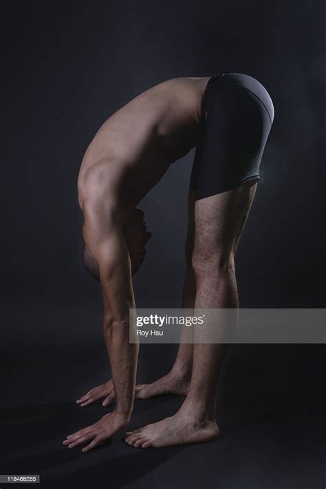 fit black man bending over and stretching photo getty images