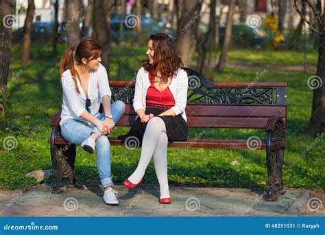 Best Friends Talking In The Park Stock Image Image Of Relaxed Sunny