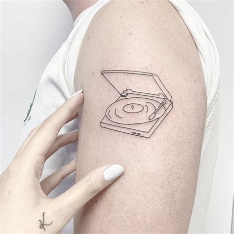 sara kori  instagram record player simplistic tattoos