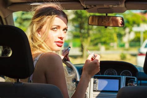 girl apply make up while driving car stock image image of cosmetic