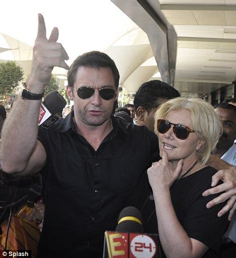 Hugh Jackman Cuddles Wife Deborra Lee Furness As They Touch Down In