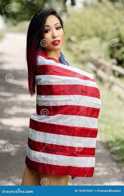 Beautiful Asian Girl Posing In The American Independence Day Stock