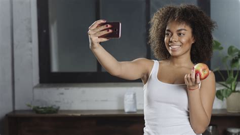 Free Photo Woman Taking Selfie In Kitchen