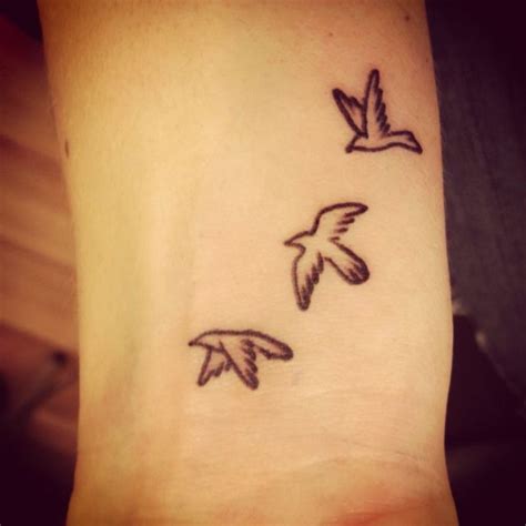 elegant birds wrist tattoos design