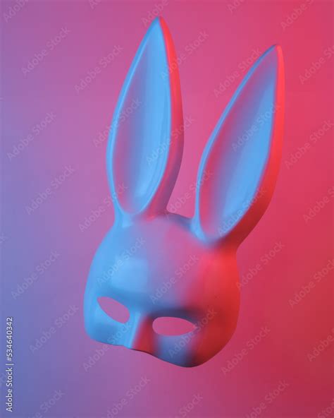 sex shop rabbit mask floating in the air isolated in blue red neon