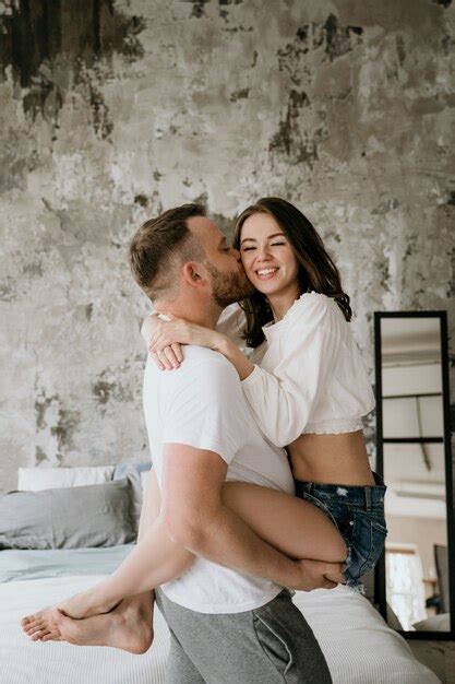 premium photo couple in love in the bedroom slender brunette
