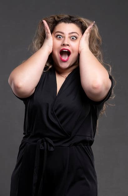 Premium Photo A Beautiful Fat Woman With Long Curly Hair Screams