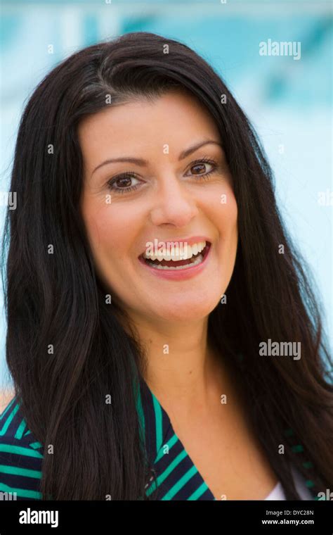beautiful middle aged brunette woman smiling stock photo  alamy