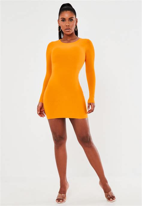 orange slinky long sleeve ruched bum mini dress missguided