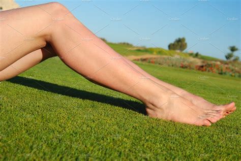 sexy female legs on the grass ~ people photos ~ creative market
