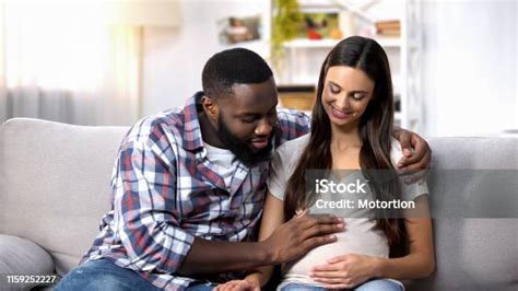 Smiling Africanamerican Man Stroking His Pregnant Wife Tummy Future