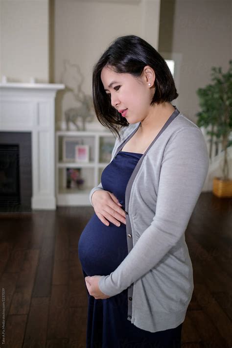 Pregnant Asian Woman At Home By Stocksy Contributor Take A Pix Media