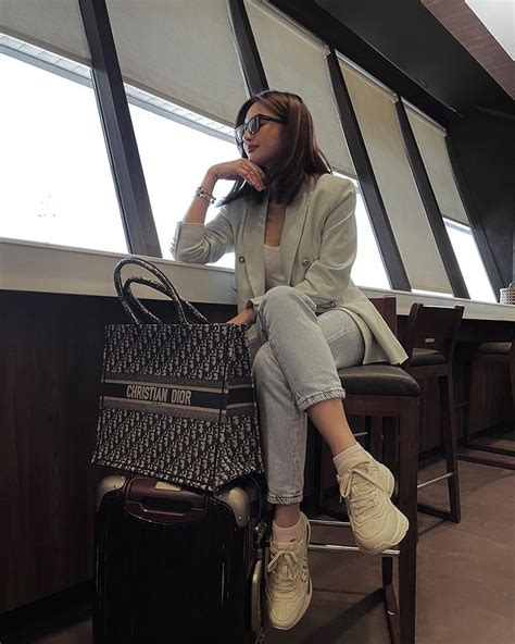 look chic and neutral airport ootd s that are celebrity approved