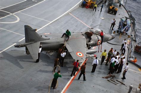 sailors stationed aboard indian navy aircraft carrier ins viraat  refuel  sea harrier