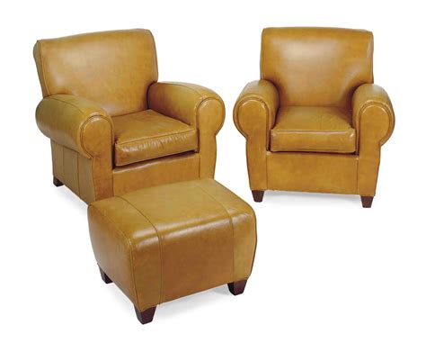 pair  tan leather upholstered club chairs  ottoman modern christies