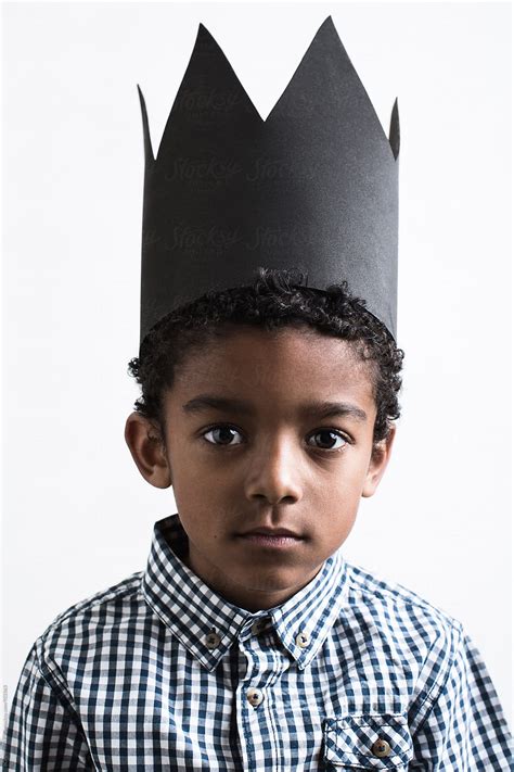 portrait   boy wearing  black crown  stocksy contributor