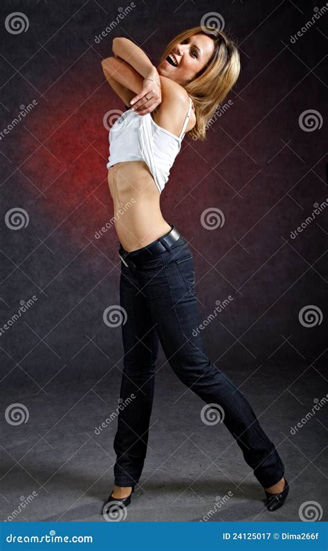 Cheerful Young Woman Taking Off Her Clothes Royalty Free Stock