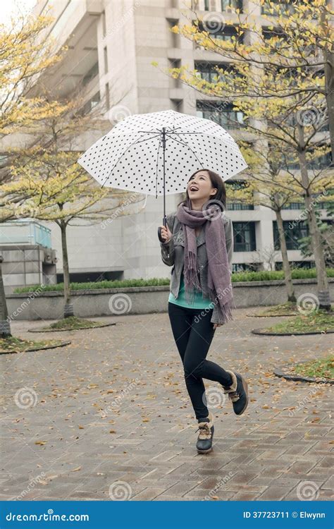 happy smiling asian woman holding an umbrella stock image image of