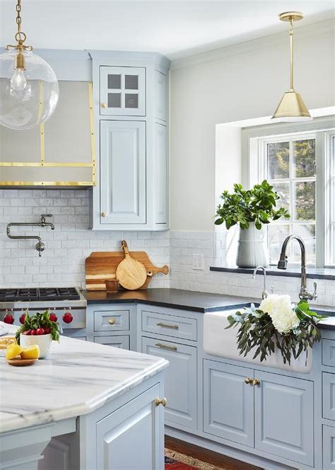 light blue kitchen cabinets  farmhouse sink transitional kitchen