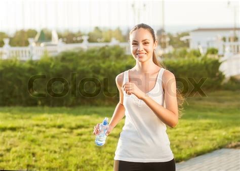 runner woman running outdoors training for marathon run beautiful fit asian fitness model in