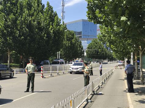 chinese man  hurt setting  explosive device    embassy  beijing  times