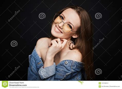 fashionable and model girl in stylish eyewear and in blue jeans jacket