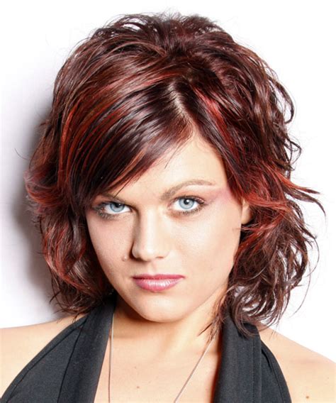 medium wavy dark red hairstyle with side swept bangs