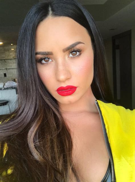 demi lovato sorry not sorry singer flashes bulging boobs in low cut