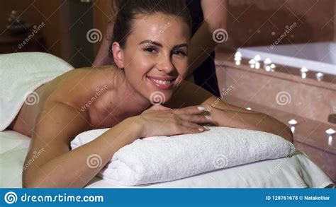 a pleasant masseuse makes the girl a professional relaxing massage