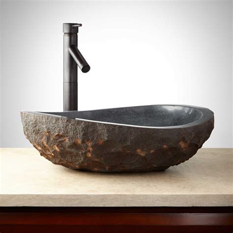 asymmetrical granite vessel sink  dark granite chiseled exterior natural stone creations