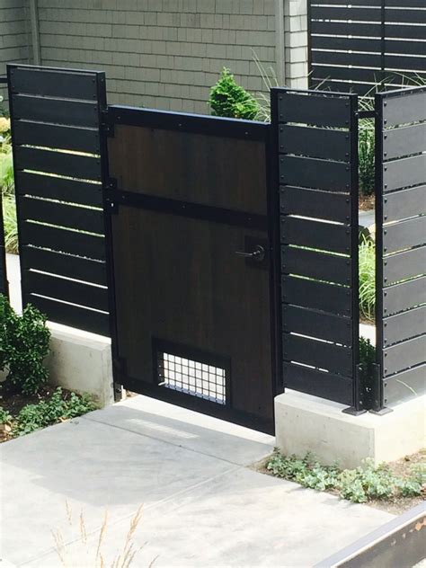 modern backyard fence and gate blackbird iron and design