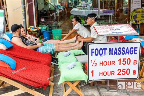 thailand bangkok khaosan road tourists having foot massage stock