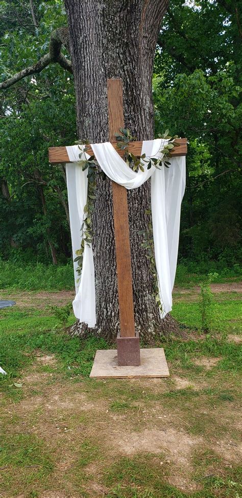 cross arbor ideas white material  greenery wooden crosses decor outdoor wedding venues