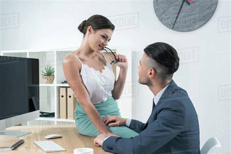 Young Sexy Secretary Seducing Her Boss At Workplace In Office Stock