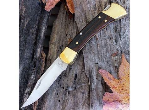 Нож складной Buck 110 Folding Hunter Finger Grooved Woodgrain Handle
