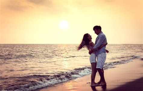 Romantic Young Couple Hug On The Beach At Sunset Stock Image Image Of