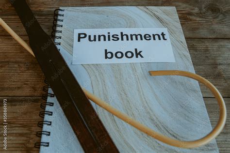 Punishment Book Leather Tawse And Cane For Spanking On Headmasters Or