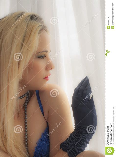 Beautiful Woman Looking Out Of Window Royalty Free Stock