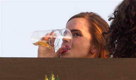 Emma Watson Downs A Pint Of Beer As She Enjoys Taylor Swift Gig With